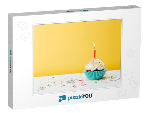 A Colorful Birthday Cupcake with One Candle & Confetti on... Jigsaw Puzzle