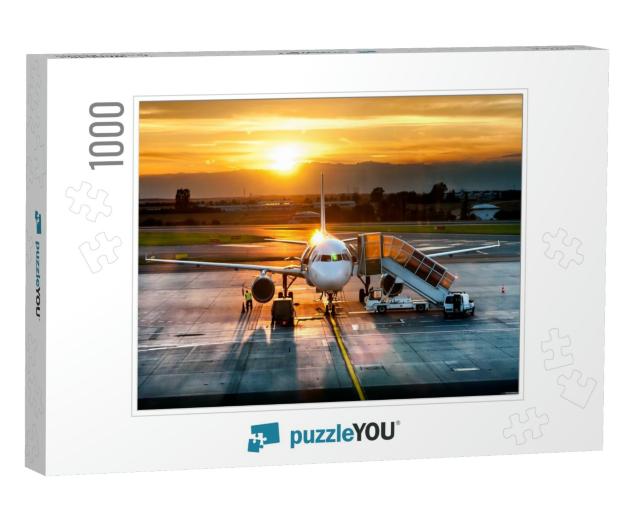 Passenger Airplane on Runway Near the Terminal in an Airp... Jigsaw Puzzle with 1000 pieces