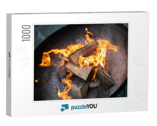 Outdoor Log Burning Fire in Black Metal Fire Pit. Chopped... Jigsaw Puzzle with 1000 pieces