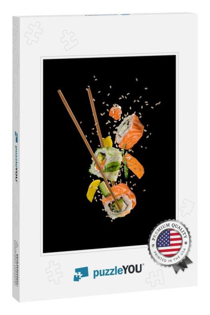 Sushi Pieces Placed Between Chopsticks, Separated on Blac... Jigsaw Puzzle