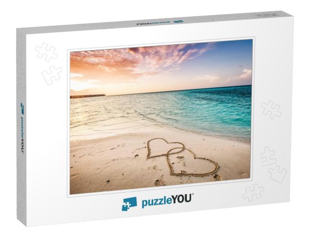 Two Hearts Drawn on a Sandy Beach by the Sea. Sunset View... Jigsaw Puzzle