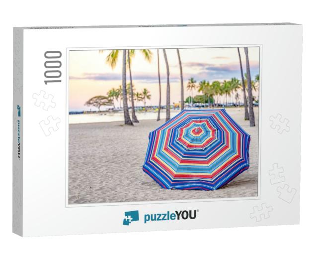 A Beautiful Striped Umbrella on the Beach At Sunset, in W... Jigsaw Puzzle with 1000 pieces