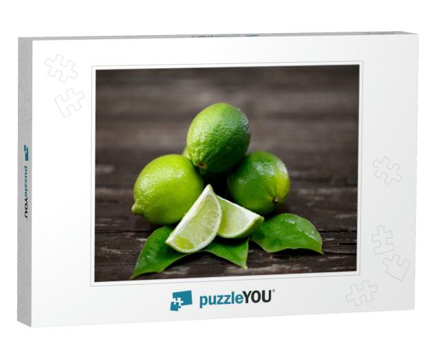 Lime Juice with Lime Slices on Wooden Table. Detox Diet... Jigsaw Puzzle