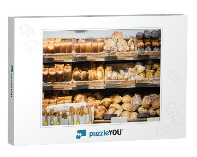 Focus on Shelves with Bread in a Supermarket... Jigsaw Puzzle
