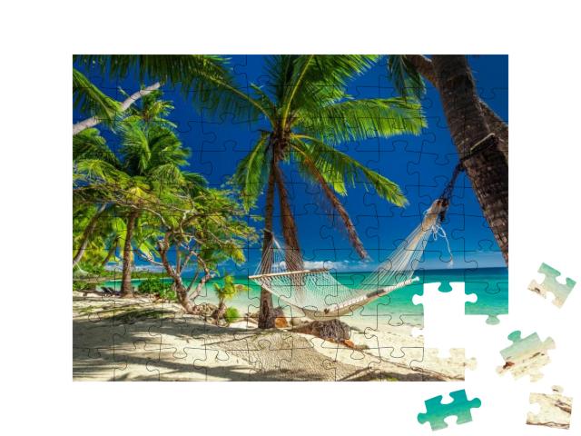 Empty Hammock in the Shade of Palm Trees on Tropical Fiji... Jigsaw Puzzle with 100 pieces