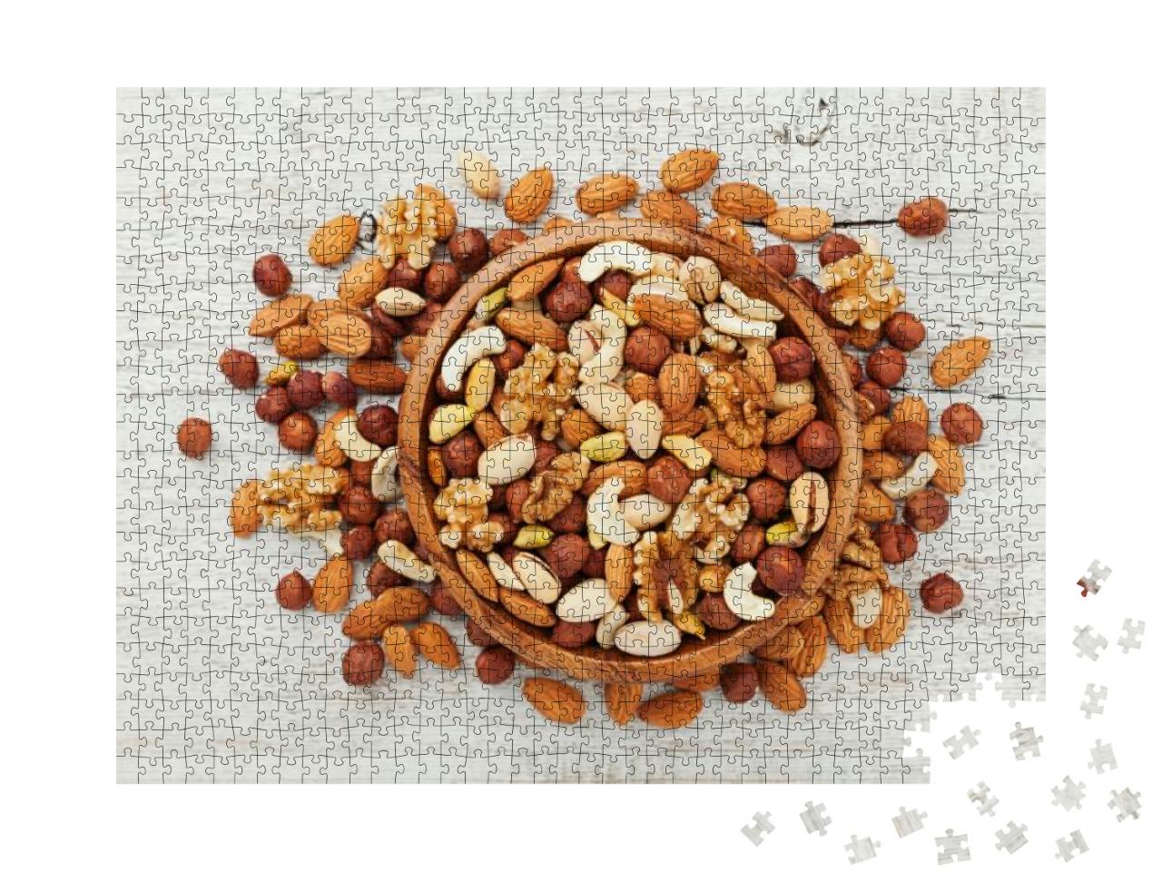 Wooden Bowl with Mixed Nuts on White Table Top View. Heal... Jigsaw Puzzle with 1000 pieces