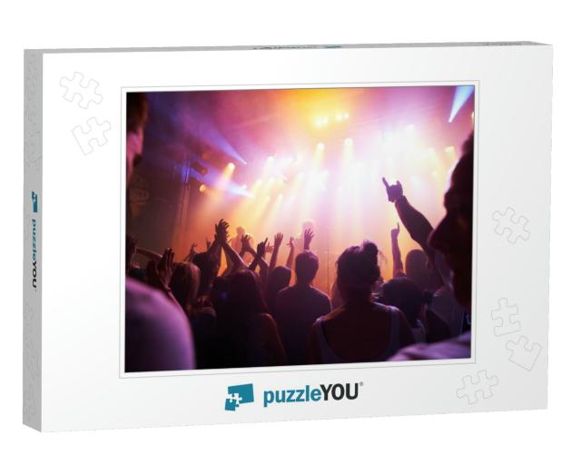 Rocking Out. Rear View of a Crowd Cheering At a Concert-... Jigsaw Puzzle