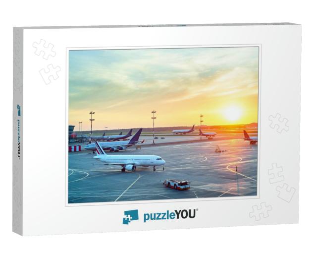Airport with Many Airplanes At Beautiful Sunset... Jigsaw Puzzle
