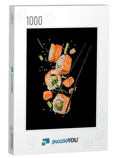 Sushi Pieces Placed Between Chopsticks, Separated on Blac... Jigsaw Puzzle with 1000 pieces