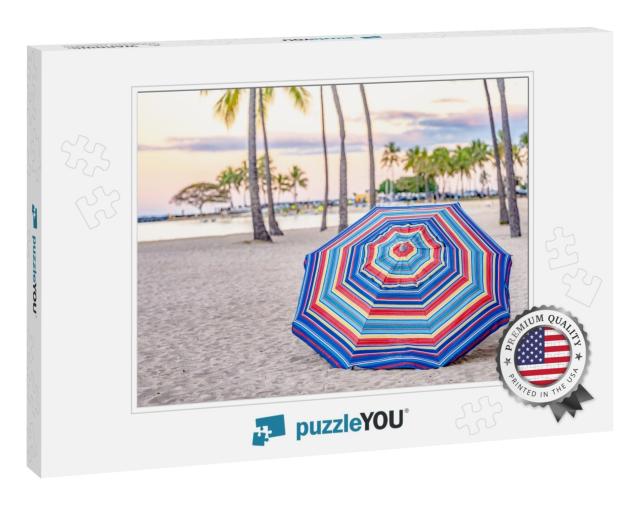 A Beautiful Striped Umbrella on the Beach At Sunset, in W... Jigsaw Puzzle