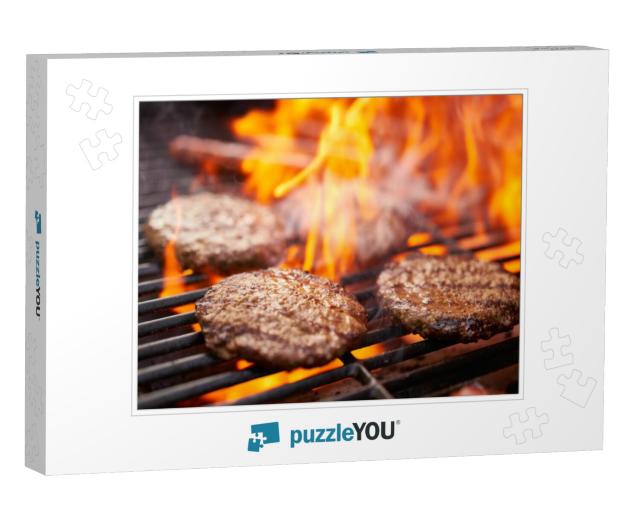 hamburgers and hot dogs cooking on grill with flam Jigsaw Puzzle