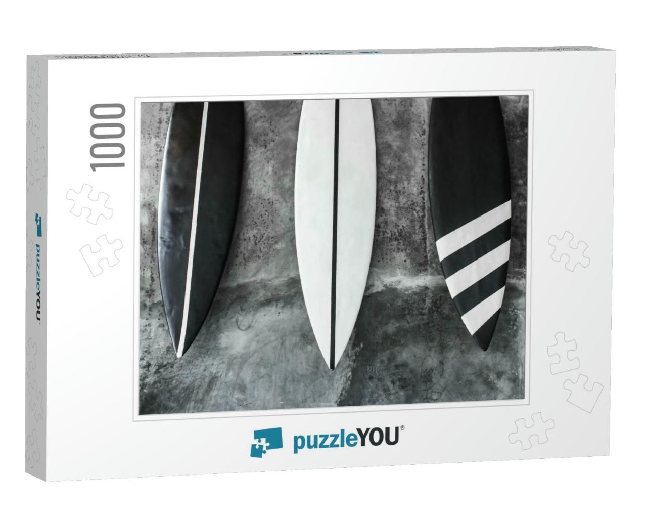 Black & White Color Surf Board on Gray Concrete Wall Back... Jigsaw Puzzle with 1000 pieces