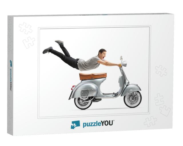 Young Man Flying & Riding a Vintage Scooter Bike Isolated... Jigsaw Puzzle