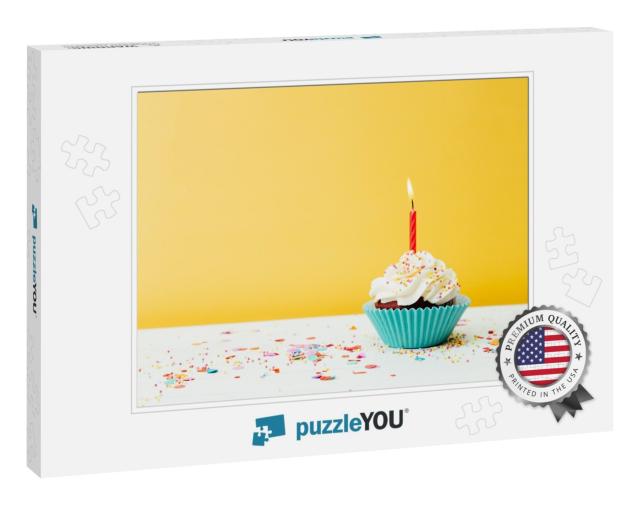A Colorful Birthday Cupcake with One Candle & Confetti on... Jigsaw Puzzle