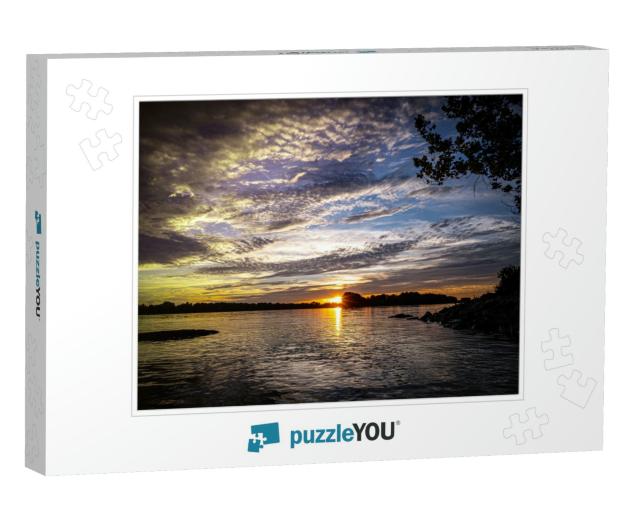 A Beautiful View of the Sun on the Horizon Next to the Mi... Jigsaw Puzzle
