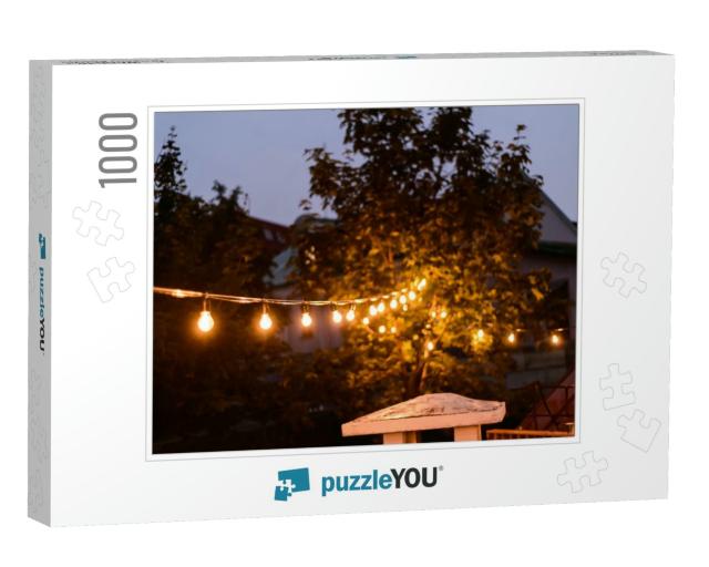 Decorative Outdoor String Lights Hanging on the Tree in t... Jigsaw Puzzle with 1000 pieces