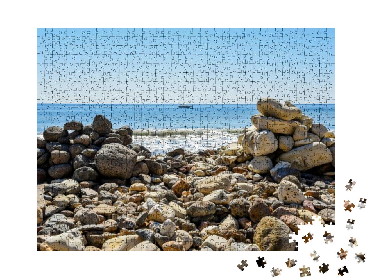 Stones on Beach At Smugglers Cove with Boat in the Distan... Jigsaw Puzzle with 1000 pieces