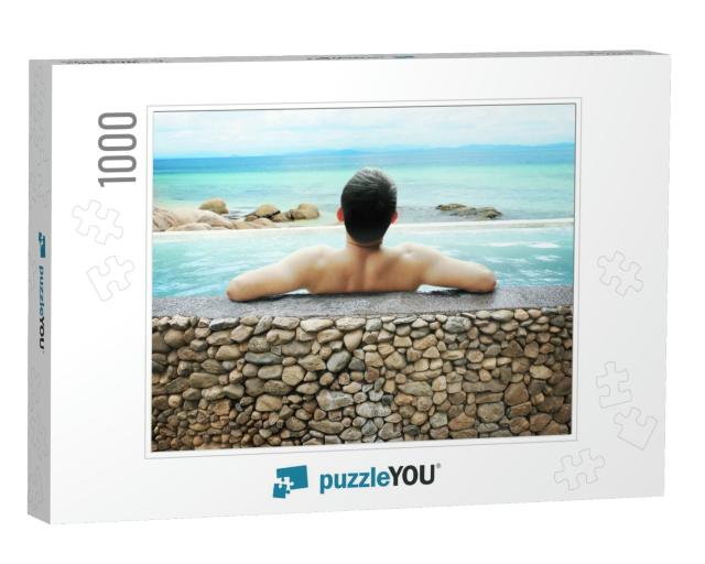Asian Man Soaking in Outdoor Pool with Sky... Jigsaw Puzzle with 1000 pieces