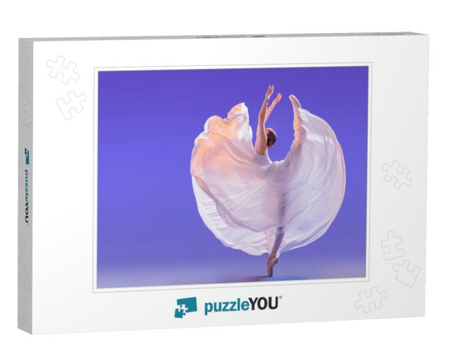 Elegant Ballerina in Pointe Shoes is Dancing in a Long Fl... Jigsaw Puzzle