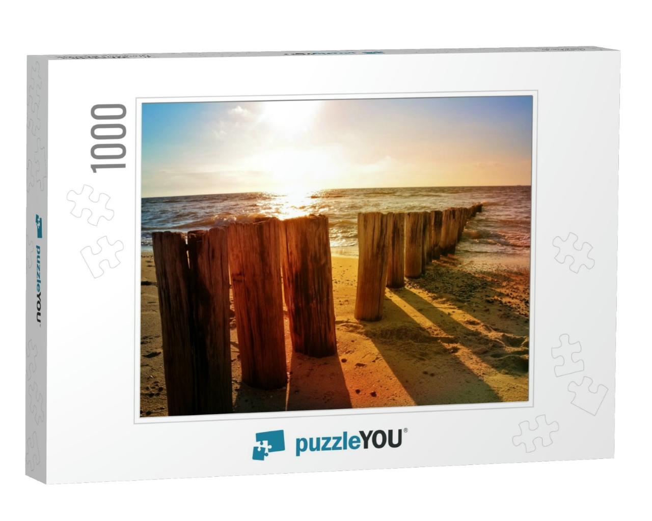Wooden Groynes At the North Sea Beach At Orange Sunset... Jigsaw Puzzle with 1000 pieces