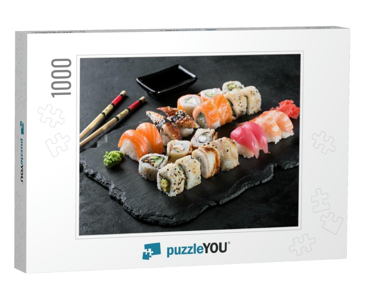 Sushi Rolls Set Served on Black Stone Slate on Dark Backg... Jigsaw Puzzle with 1000 pieces
