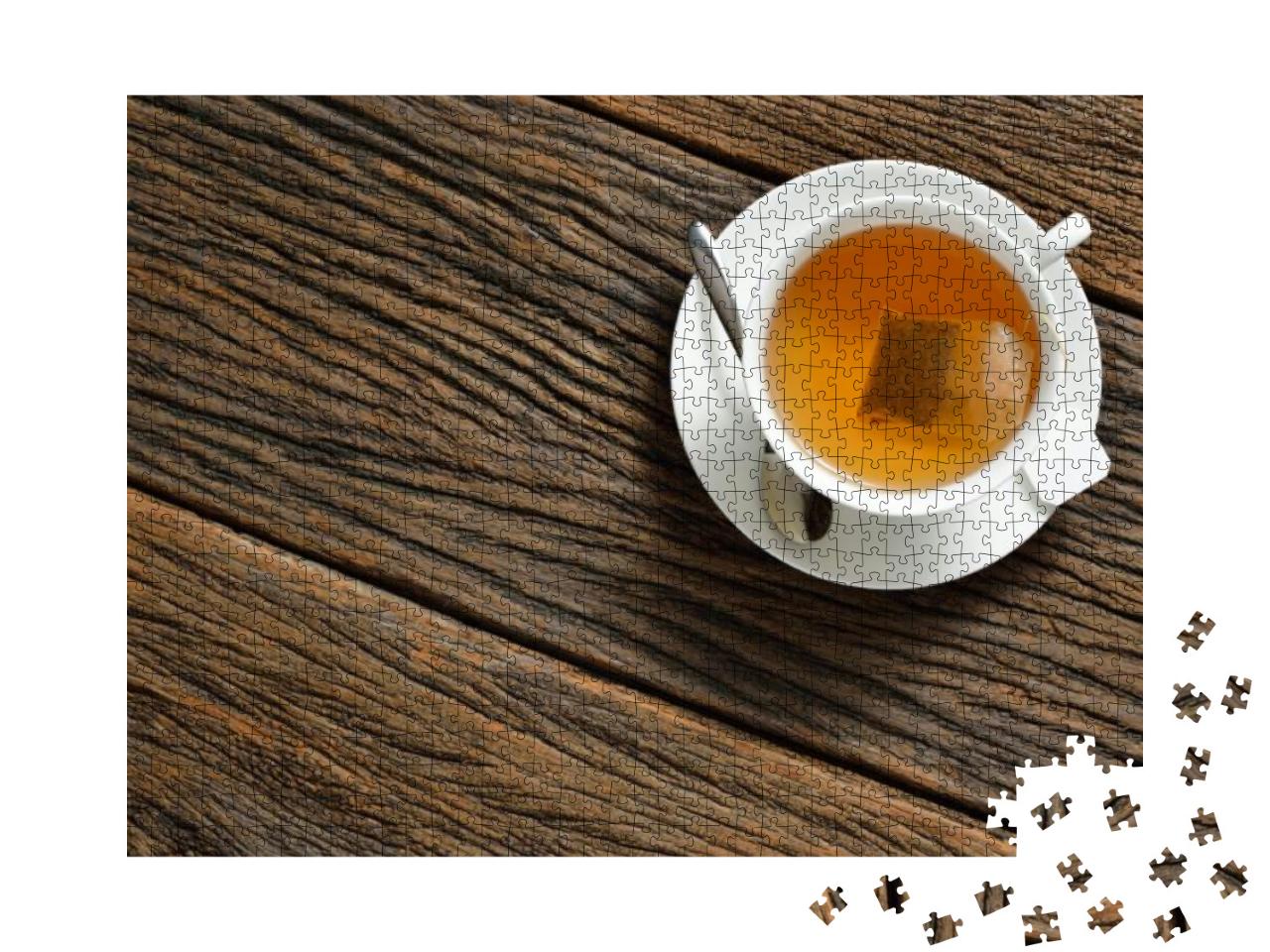 Top View of a Cup of Tea with Tea Bag on Wooden Table... Jigsaw Puzzle with 1000 pieces
