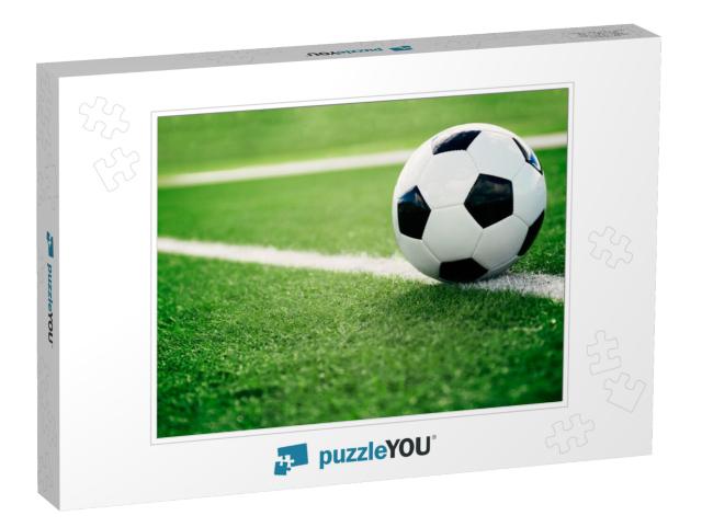 Traditional soccer ball on soccer field Jigsaw Puzzle