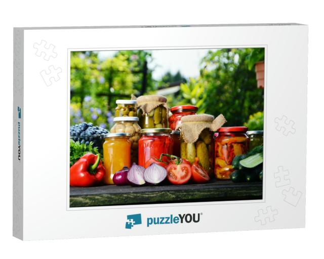 Jars of Pickled Vegetables in the Garden. Marinated Food... Jigsaw Puzzle