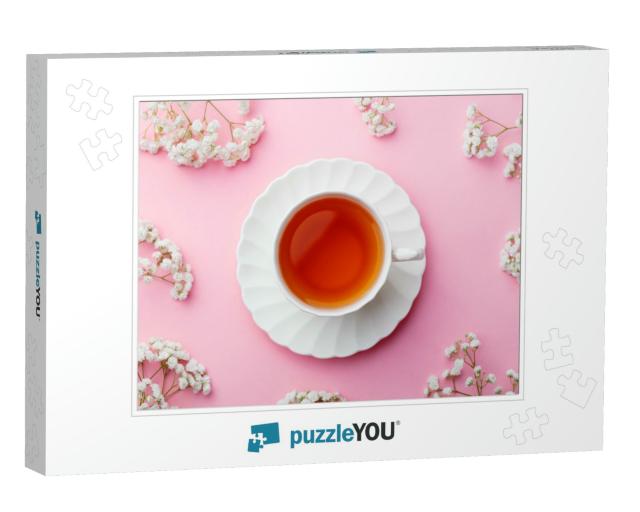 Cup of Tea with Fresh Flowers on Pink Background. Top Vie... Jigsaw Puzzle