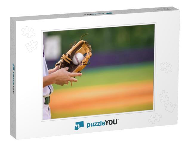 A Young Adult Male Baseball Player Holding a Baseball Glo... Jigsaw Puzzle