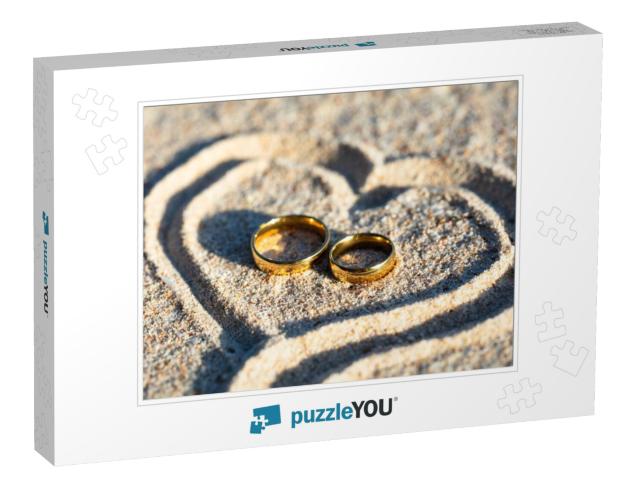 An Overhead View of Golden Wedding Rings Inside Th... Jigsaw Puzzle