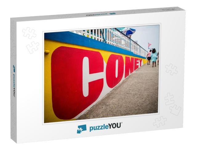 A Group of Women Walk Along the Coney Island Sign At Cone... Jigsaw Puzzle