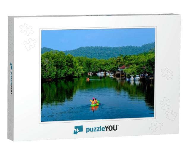 A Surfer is Kayaking in a Beautiful Stream... Jigsaw Puzzle