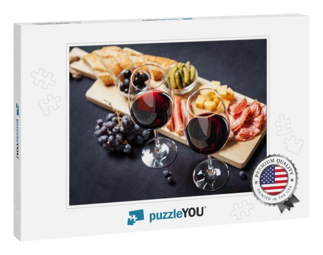 Red Wine with Charcuterie Assortment on the Background... Jigsaw Puzzle