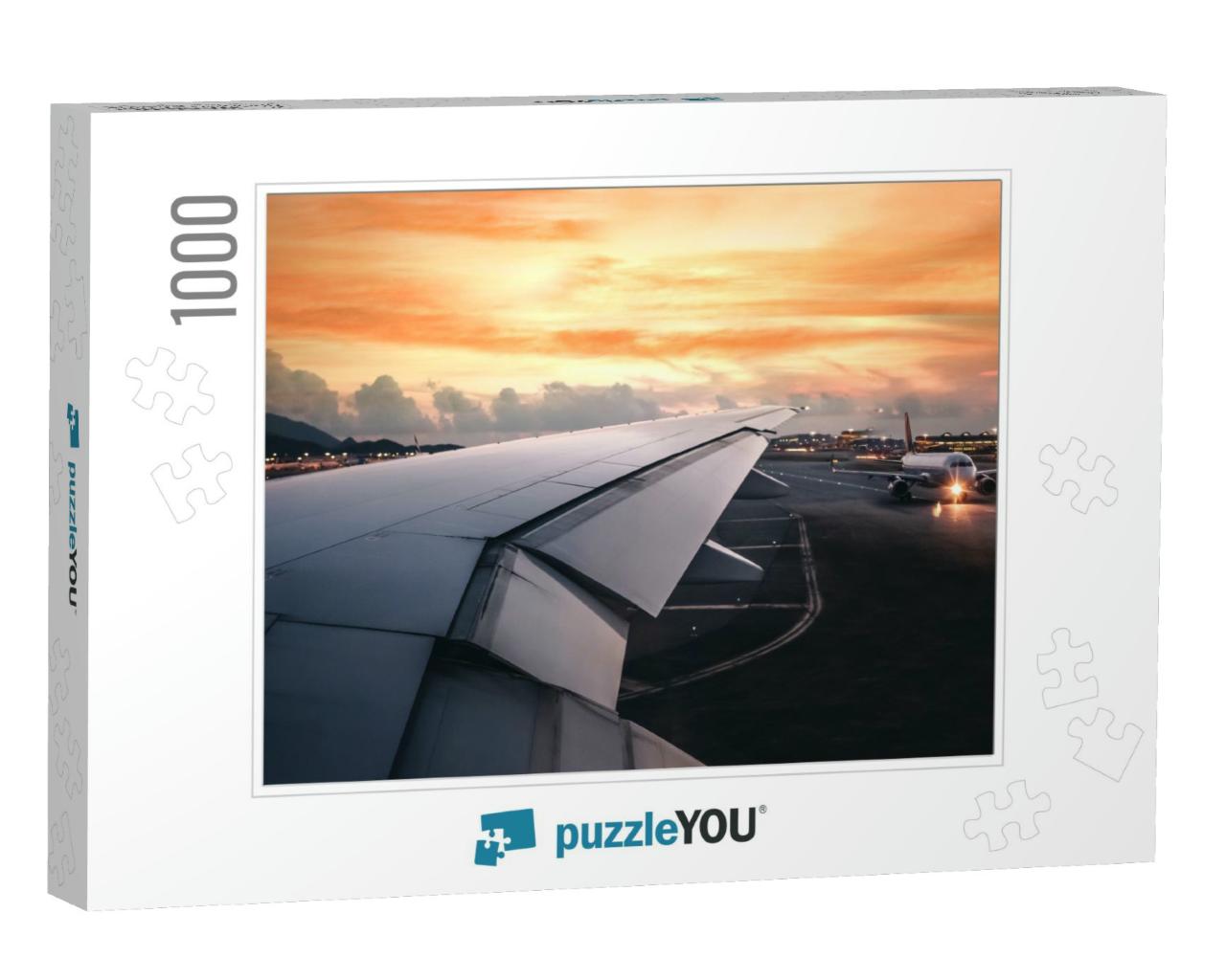 Wing of an Airplane Taking Off on Run Way in Terminal wit... Jigsaw Puzzle with 1000 pieces