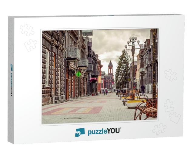 Scenic Old Paving Street with Church on the Background in... Jigsaw Puzzle