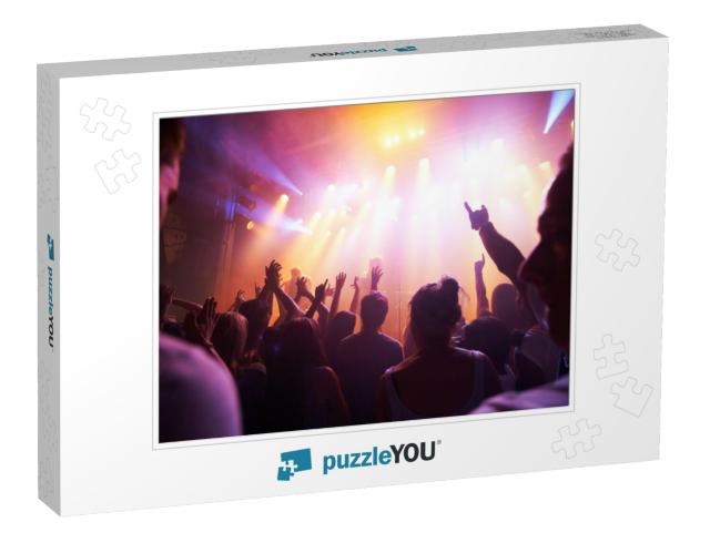 Rocking Out. Rear View of a Crowd Cheering At a Concert-... Jigsaw Puzzle