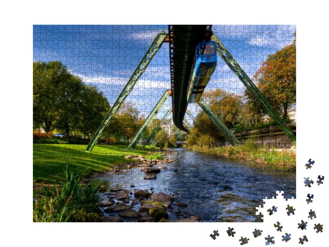 A Train of the Wuppertal Suspension Railway Over the Wupp... Jigsaw Puzzle with 1000 pieces