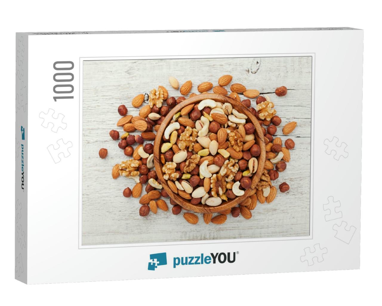 Wooden Bowl with Mixed Nuts on White Table Top View. Heal... Jigsaw Puzzle with 1000 pieces