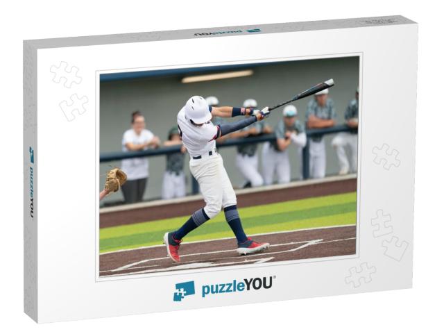 Young Boy Swinging the Bat for a Hit in Baseball Game... Jigsaw Puzzle