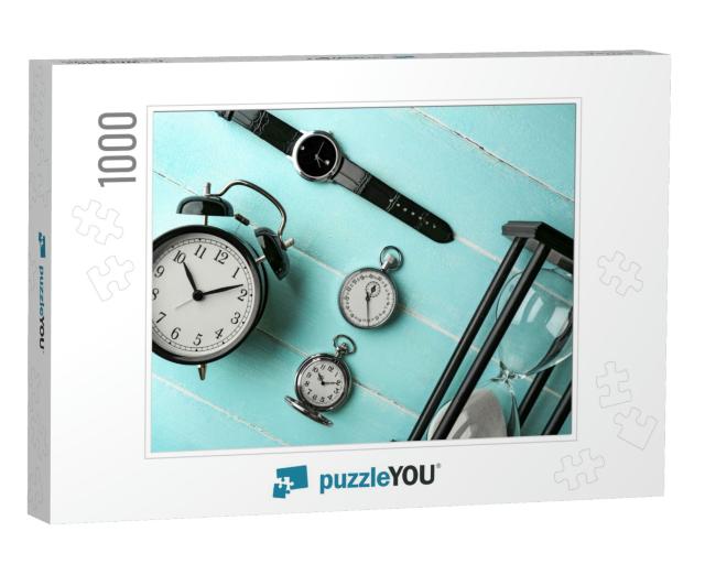 Different Kinds of Watches on Light-Blue Table... Jigsaw Puzzle with 1000 pieces