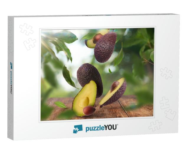 Fresh Raw Avocados Falling in the Air on Wooden Table Ove... Jigsaw Puzzle