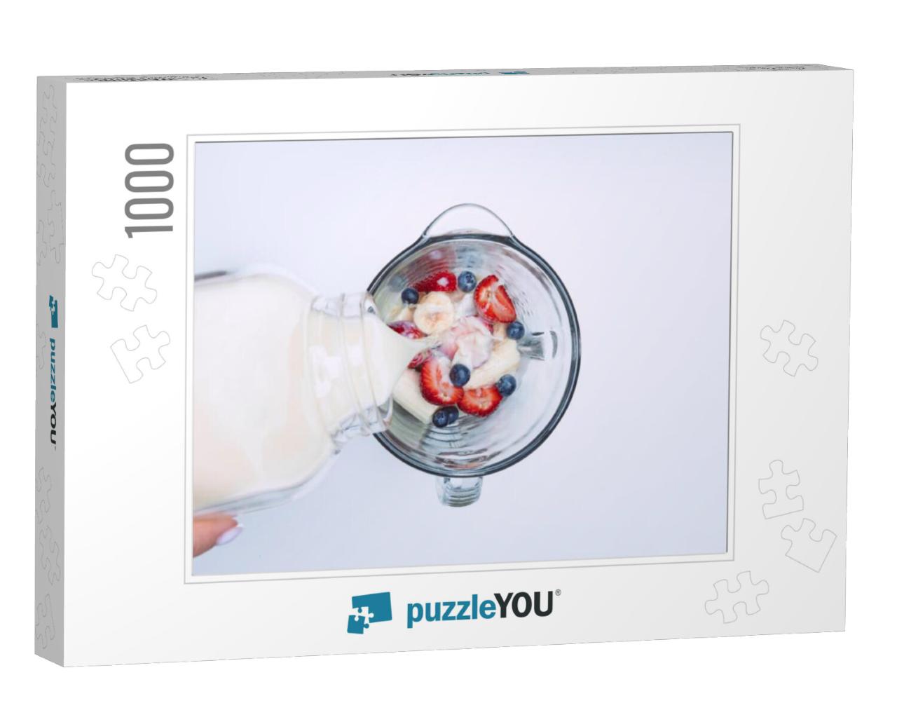 Making smoothie or milkshake in blender. Pouring m Jigsaw Puzzle with 1000 pieces