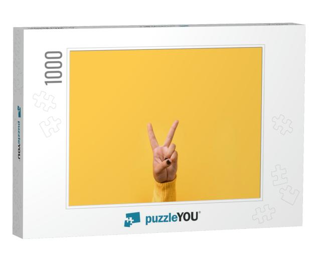 Hand Gesture V Sign for Victory or Peace Sign Over Yellow... Jigsaw Puzzle with 1000 pieces