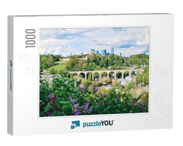 Landscape with Lilac Flowers, High-Rise Buildings in the... Jigsaw Puzzle with 1000 pieces