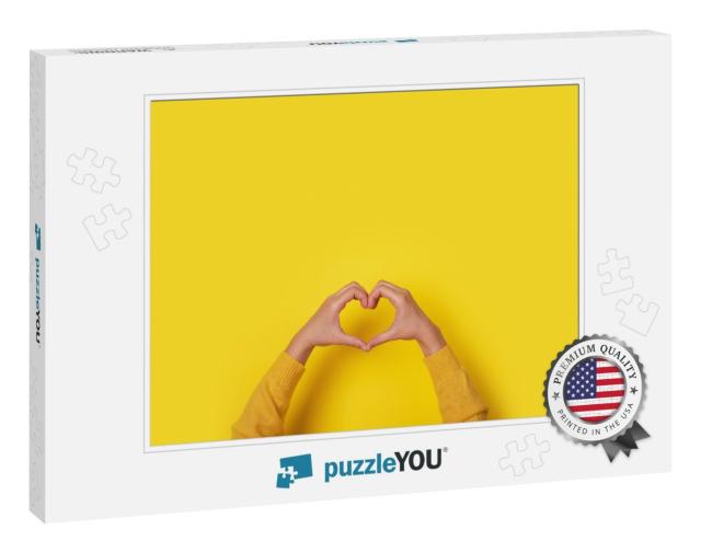 Hands Making Heart Shape, Love Symbol Over Yellow Backgro... Jigsaw Puzzle
