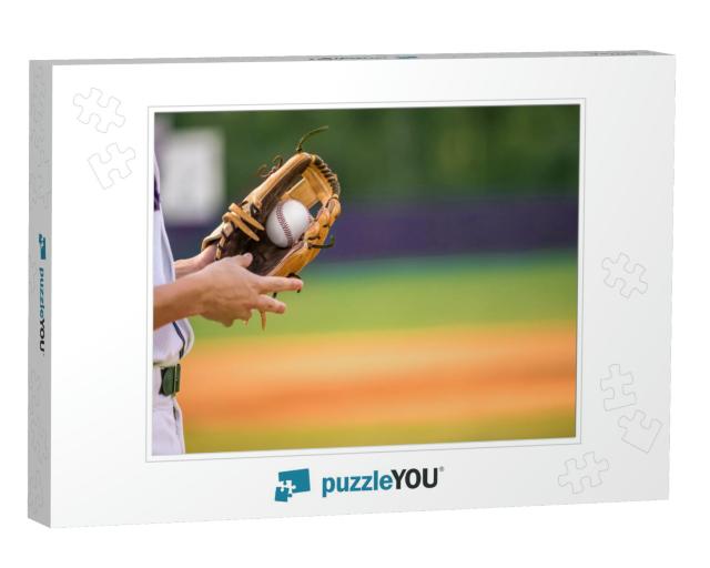 A Young Adult Male Baseball Player Holding a Baseball Glo... Jigsaw Puzzle