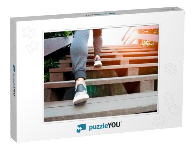 A Man Step Up to Success, Sport Man is Climbing on Wooden... Jigsaw Puzzle