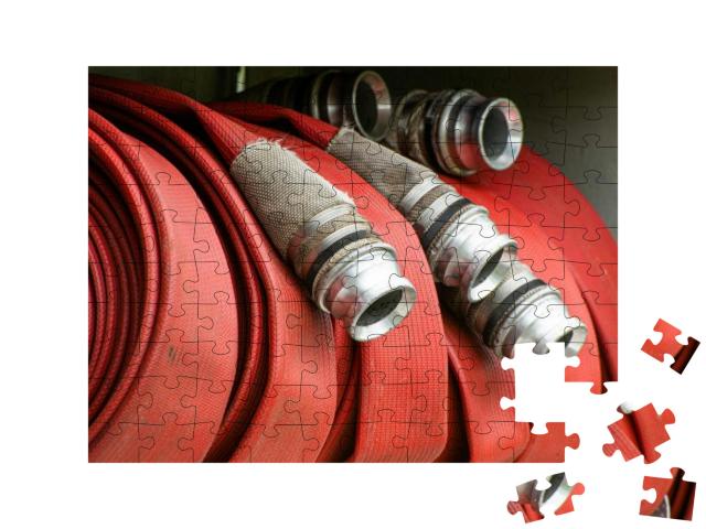 Fire Hose on Fire Engine in the Uk... Jigsaw Puzzle with 100 pieces