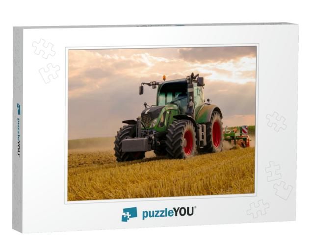 Green Tractor Plowing Cereal Field with Sky with Clouds... Jigsaw Puzzle